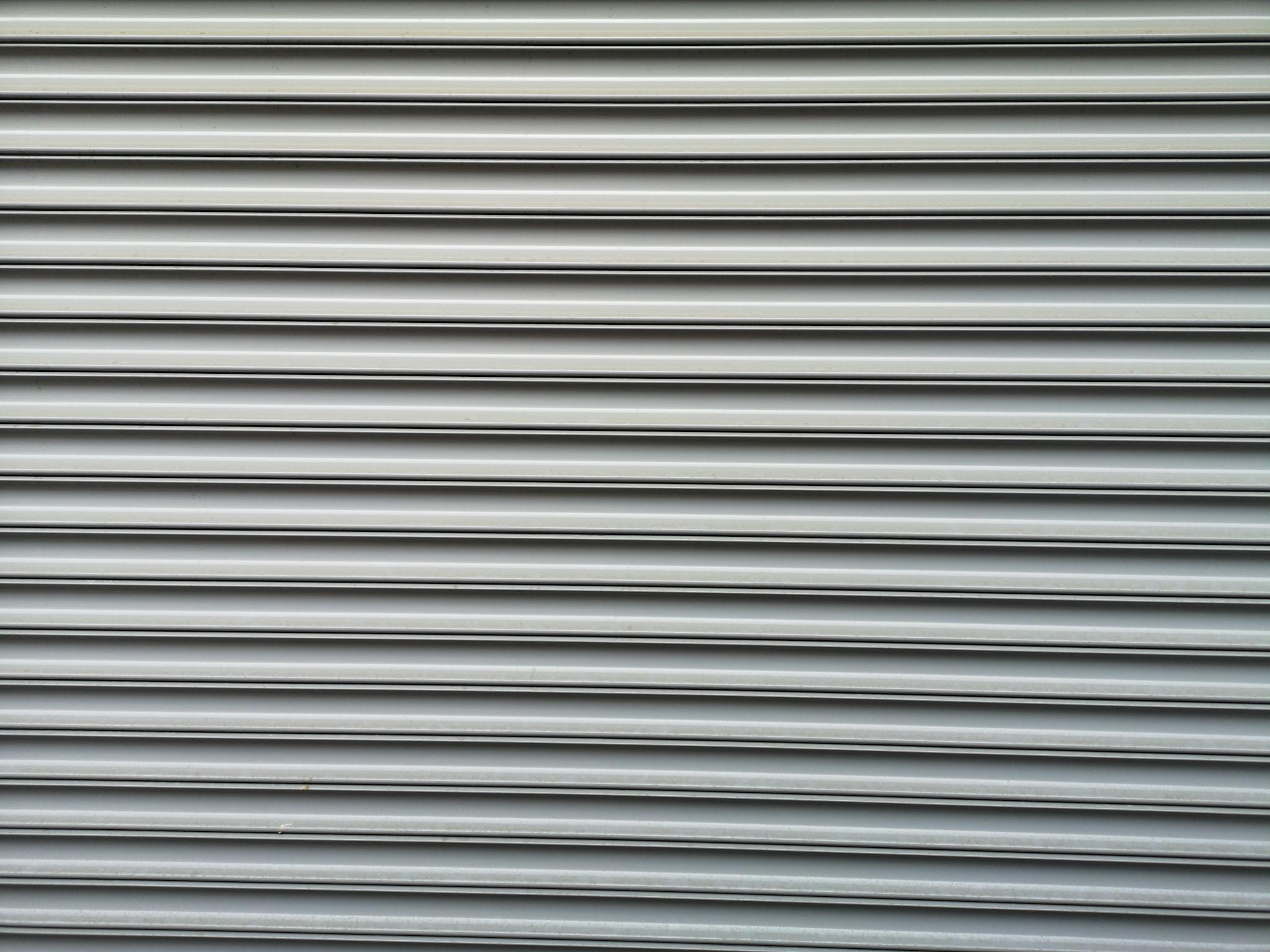 Detailed metallic roller shutter texture ideal for industrial themes.